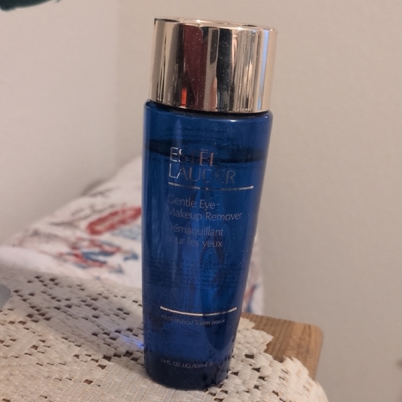 Estee Lauder Blue Makeup Remover in a Cylindrical Bottle